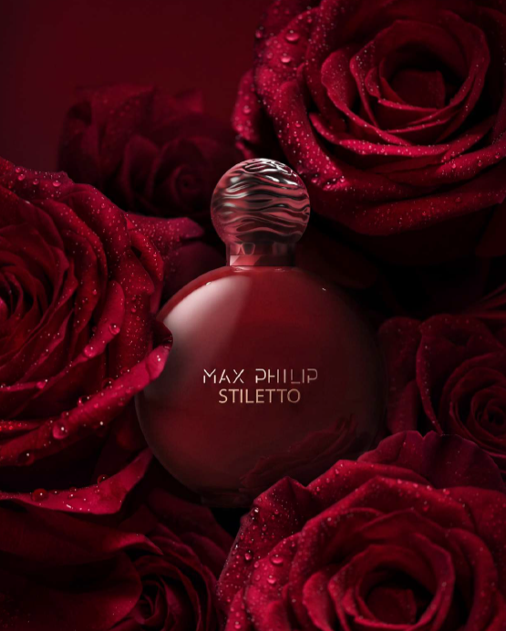 Красный флакон Max Philip Stiletto на фоне красных роз